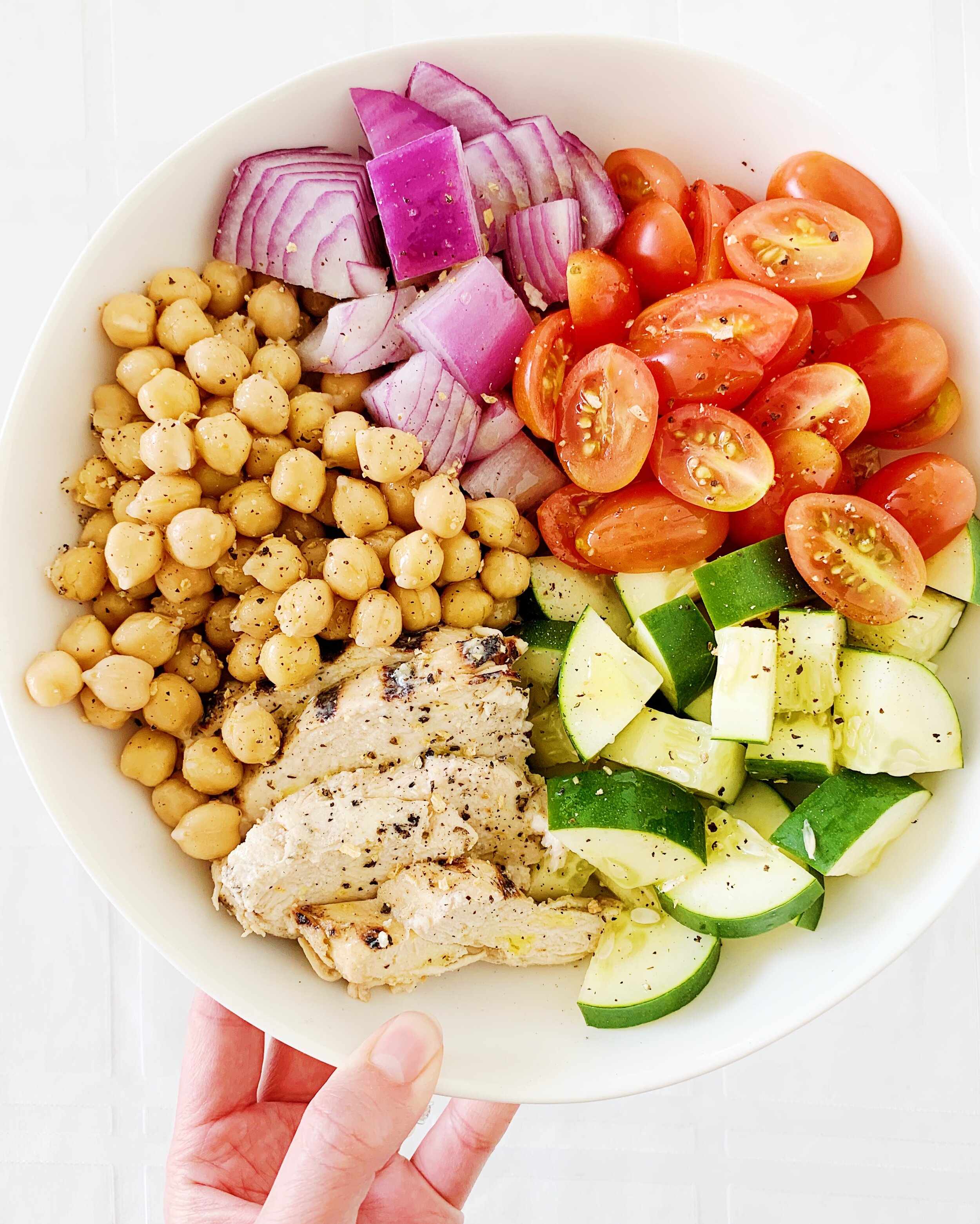 Lettuce-less salad with chickpeas, tomatoes, cukes, onions, and grilled chicken 